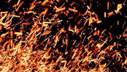 Fototapeta na wymiar Fire embers particles over black background. Fire sparks background. Abstract dark glitter fire particles lights. bonfire in motion blur.