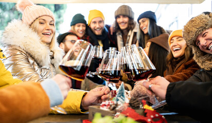 Trendy friends enjoying together drinking at winter time - Life style concept with millenial people...