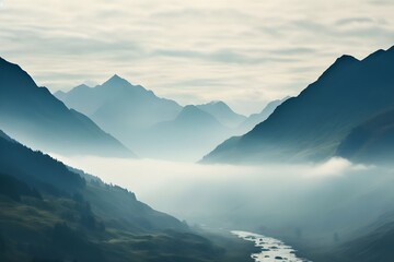 Mountain landscape with fog. Peaks of mountain range in the mist.