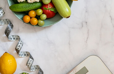 Diet and Healthy Life Weight Loss Concept. Organic green apple and scales measure faucet with vegan plant and sports equipment for women's body weight loss diets are suitable. Top view and copy space.