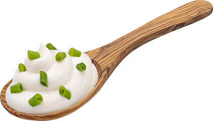 Wooden spoon of sour cream with green onion isolated