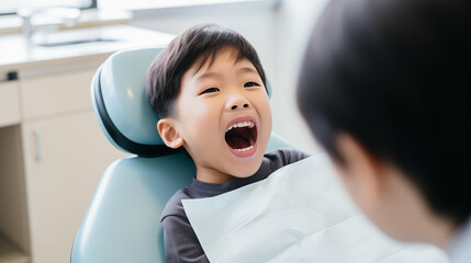 Asian boy with his mouth open at a dental clinic. Generative AI. - obrazy, fototapety, plakaty