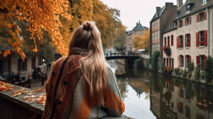 Woman sightseeing in a cozy small town in 
Autumn 