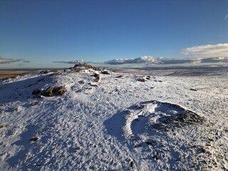 UK, Dartmoor National Park, Yes Tor covered by snow, view from drone