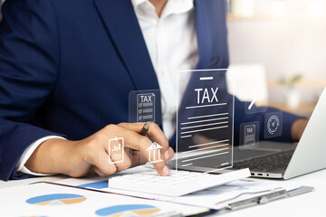 Tax and Vat concept. Government, state taxes concept. Businesman using calculator and laptop to complete Individual income tax return form online for tax payment. Data analysis, financial research. - obrazy, fototapety, plakaty