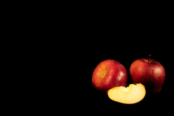 Red apple on black background