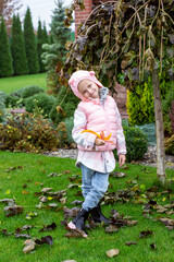 little child playing in the woods