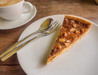 macadamia pie on a dish and coffee