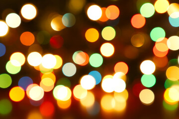 Colorful blurred bokeh lights. Abstract colorful Christmas tree garland lights background. Festive...
