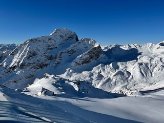 Switzerland, glacier next to Piz Nair peak in Alps, covered by snow