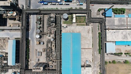Chemical energy industry site power manufacturing factory pipe gas line top drone view smoke air pollution
