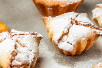 muffins and cupcakes sprinkled with powdered sugar, Food recipe background. Close up