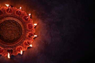 Happy Diwali festival background with greeting text, Diwali Diya lamp isolated on dark background