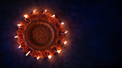 Closeup image of traditional Diya lamp, Happy Diwali background