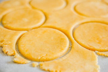pastry-making with this captivating image featuring a close-up of perfectly cut shortcrust dough circles in a kitchen setting