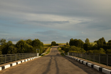 Fototapeta premium The old road rests against the sky. The old road.