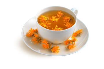 Cup and saucer with calendula tea isolated on white background