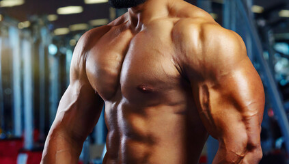 Fototapeta na wymiar Close-up shot of muscular male body and Bodybuilding athlete