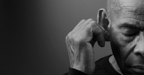  suffering from deafness and hearing loss on grey black background with people stock image stock...