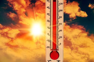 Thermometer with red degrees on sky background