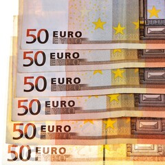 A lined row of isolated 50 euro banknotes: 300 euros in six 50 € bills isolated on white...