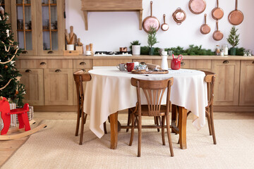 Stylish dining room in rustic style. Cozy kitchen decorated Christmas or new year. horse rocking...