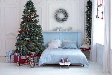 Bright bedroom with decorated christmas tree and comfortable bed. Concept new year and winter holidays. Scandinavian room style. Interior design bedroom. New year winter home interior decor