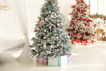 Two Christmas trees with lights glowing garlands and gifts. Cozy living room interior with decorated Christmas tree. Xmas at home. New year winter home decor. Festive interior design.	
