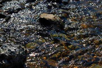 Stunning close-up of a tranquil body of water cascading over rocks in New Zealand