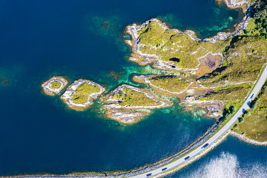 Aerial view of Dynamic fjord landscape in Norway with bridges connecting Islands in the Ocean   