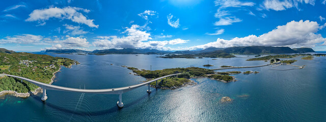 Aerial view of Dynamic fjord landscape in Norway with bridges connecting Islands in the Ocean   