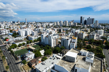 Fototapeta premium Beautiful aerial view of the city of Santo Domingo - Dominican Republic with is Parks, buildings, suburbs ,turquoise Caribbean ocean, parks and malecon
