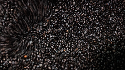 dark coffee beans and roasted spinning cover professional machine, close up to soft focus, take low speed photo to need movement and coffee beans detail concept,