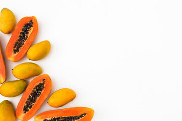 Tasty papaya and mango fruits on white background. Flat lay. Top view - obrazy, fototapety, plakaty