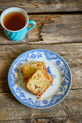 Pieces of sweet bread. Wooden background, side view.