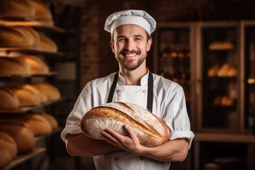 Photo sur Aluminium Boulangerie Baker in chef uniform holding fresh bakery bread food production industry