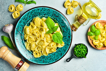 Traditional pelmeni, ravioli, dumplings with meat on a dark background. banner, menu, recipe place for text, top view