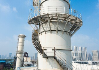 Staircase leading up the side of an industrial chimney in a thermal power plant