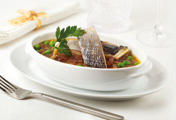 Peruvian chita soup with peas and onion