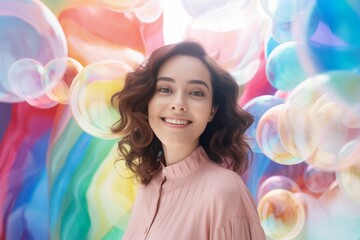 happy smiling woman on colorful background with rainbow soap balloon with gradient