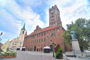 Toruń's Gothic town hall with cloudy sky in Poland © robnaw