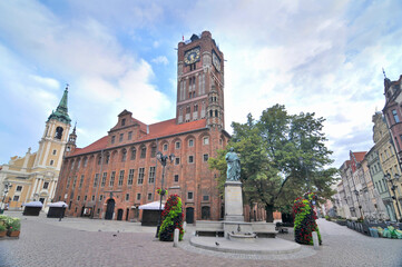 Toruń's Gothic town hall with cloudy sky in Poland © robnaw