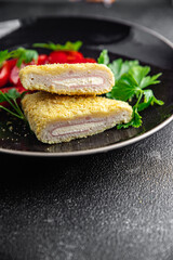 cordon bleu cutlet chicken meat, cheese, bacon snack meal food on the table copy space food background rustic top view