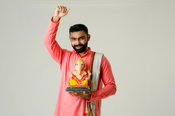 Young Indian man with Lord Ganesha , Celebrating Ganesha festival