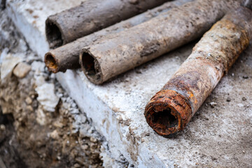 Detail shot with old and rusty drinking water pipes