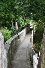 Pathway winds its way through a lush green landscape. York, England, UK.