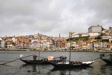 Panoramic view of Porto with Duoro river on a cloudy day, Porto cityscape with boats