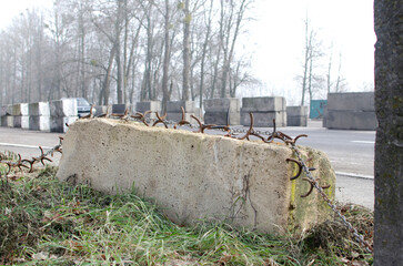 Concrete barrier on the road during the war in Ukraine