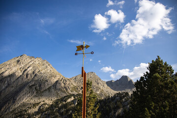 Obraz premium Steel Wind Direction Indicator with arrow in the mountains, Pyrenees