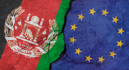 Afghanistan and European Union flags, concrete wall texture with cracks, grunge background, military conflict concept © Sergio